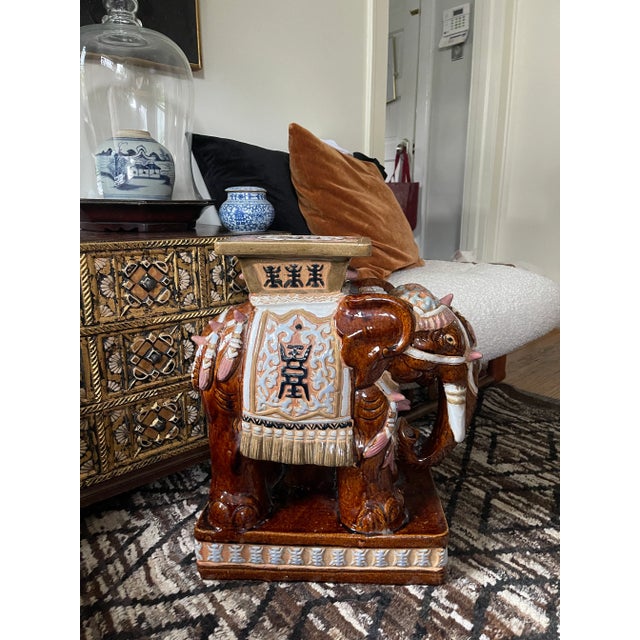 Fantastic, heavy terra-cotta clay, elephant garden stool, presented in muddy browns, soft olive, pale blue, mauve and navy...