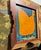 “Marigold” is a wonderful, funky chicken in orange with black speckles and impressive green and blue plumage on canvas...