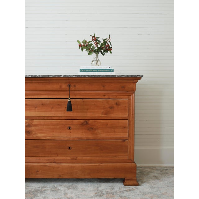 This gorgeous piece is a French Louis Philippe commode dating from the mid-1800's. While most Louis Philippe commodes we...