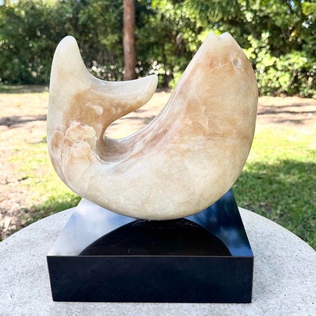 Striking vintage modernist sculpture hand carved from natural marble in the form of a stylized fish. The fluid, minimalist...