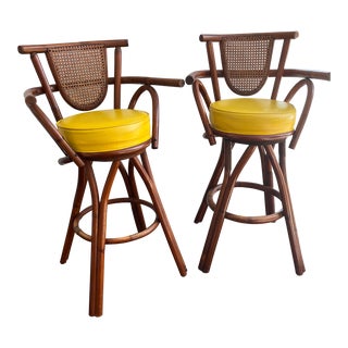 Pair of Vintage Rattan Swivel Bar Stools With Naugahyde Seats For Sale