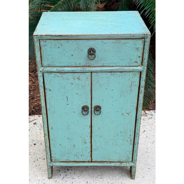 I love this distressed one drawer stand/cabinet lacquered in a wonderful shade of blue. One drawer with one shelf cabinet...