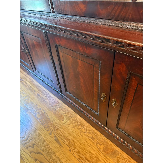 A magnificent china display cabinet from Henredon's celebrated Natchez Collection — a grand statement piece that anchors...