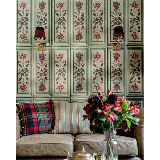 With its painterly strokes and folkloric inspired elements, this trompe l’oeil paper is designed to create the look of...