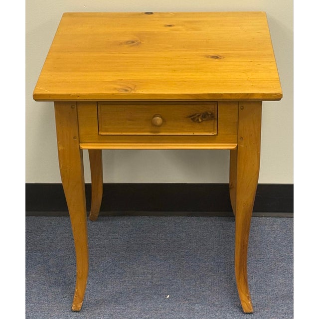 Charming one drawer end table by Lane. Features pine wood construction, cabriole leg and single dovetailed drawer. Good...
