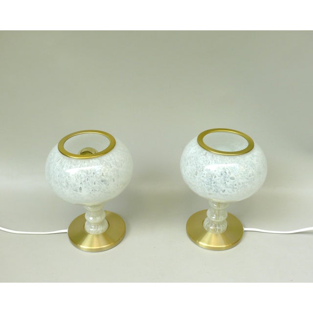 A pair of delicate, elegant table lamps by Doria from the 70s. They are made in the high quality that Doria is known for....