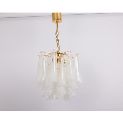 A stunning murano glass petals chandelier in style of mazzega, italy, manufactured in the 1980s. The chandelier is...