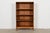 A sleek and stylish Mid-Century Modern oak bookcase By Henredon USA, Circa 1970s Measures: 33"W x 12"D x 54.5"H. Very good...