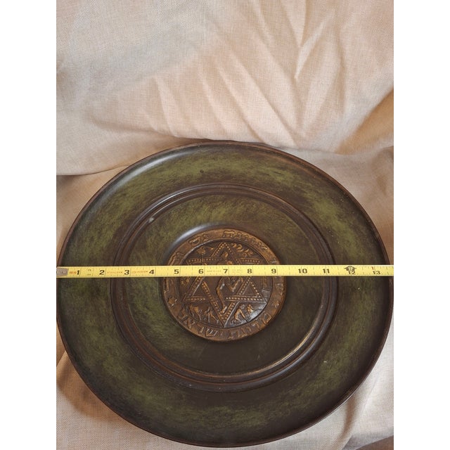 This is a premier example of "Israeliana" metalwork, significantly more substantial than the standard decorative plates of...