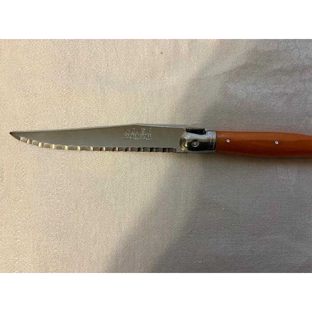 Set of 6 French Laguiole steak knives designed by Andre Verdier. These knives are dishwasher safe (acrylic handles with...