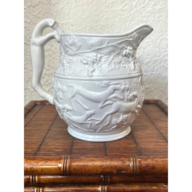Lovely Italian white pitcher with hound and stag hunting scene. Figural handle of a hunting dog. Marked made in Italy....