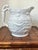 Lovely Italian white pitcher with hound and stag hunting scene. Figural handle of a hunting dog. Marked made in Italy....