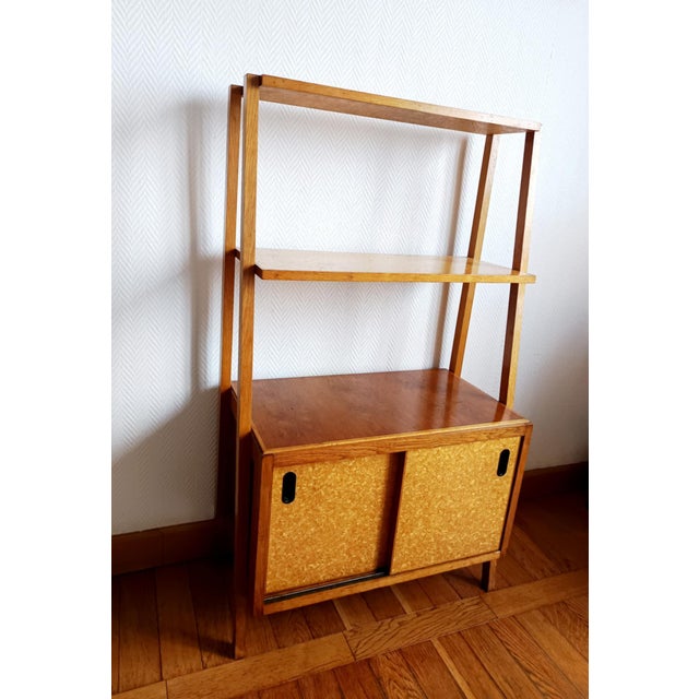 Vintage freestanding bookcase, circa 1960, Scandinavian style. This bookcase rests on four light wood legs. It features...
