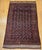 This early 20th century vintage Baluch tribal area rug features an allover geometric design woven in a striking palette of...