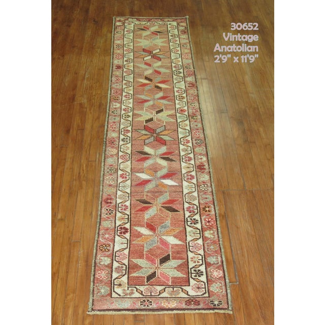 Turkish Anatolian runner with a repetitive geometric star motif on a neutral color ground from the middle of the 20th...