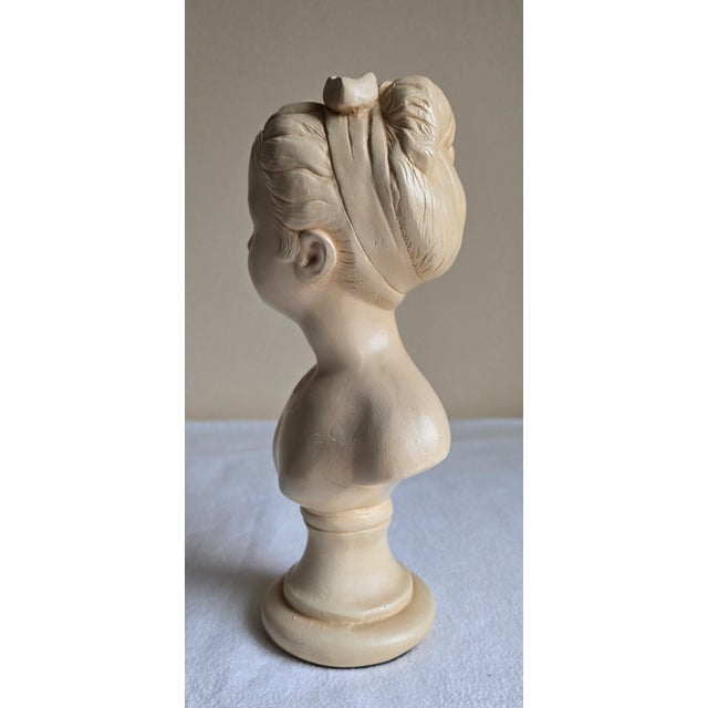 Description: Made by Alexander Backer Chalkware bust Young girl with bow Condition: Minor signs of age and use Some chips,...