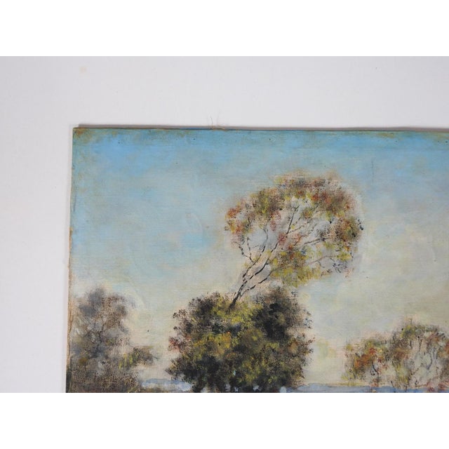 Mid 20th century oil on canvas mounted on masonite impressionist landscape painting with windswept trees. Unsigned....