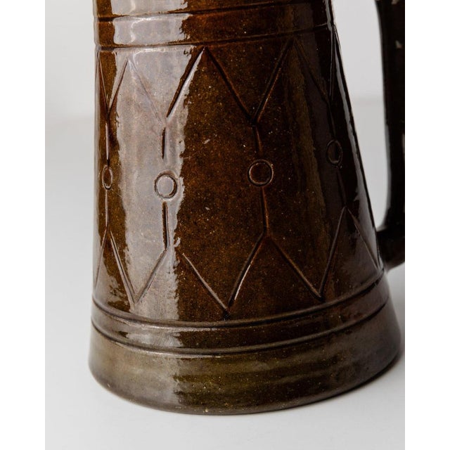 This vintage ceramic jug by Urbano Fontana, designed in Italy in the 1970s, impresses with its brown glaze and detailed...