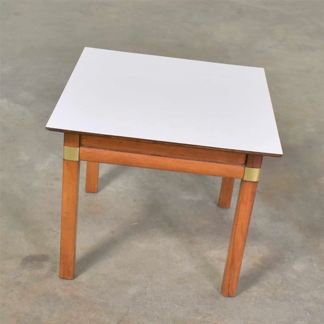 Handsome and useful small square campaign style side, end, or occasional table with a white laminate top made by Hickory...