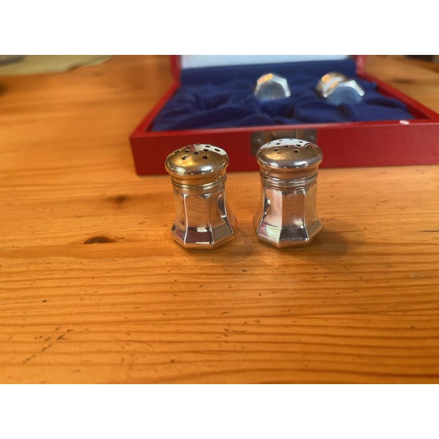 Presenting a stunning set of Cartier Salt & Pepper Shakers crafted from sterling silver. This four-piece set comes...