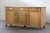 This stunning Danish Mid-Century Modern low sideboard, crafted from solid Nordic oak, is a true work of art that embodies...