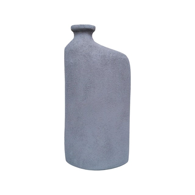 Earthy, sculptural, and effortlessly refined, this vase brings a grounded, organic presence to any space. Crafted with a...