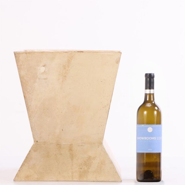 The basket has a sculptural, geometric silhouette wrapped in hand-dyed parchment. The angular design lends an accent of...