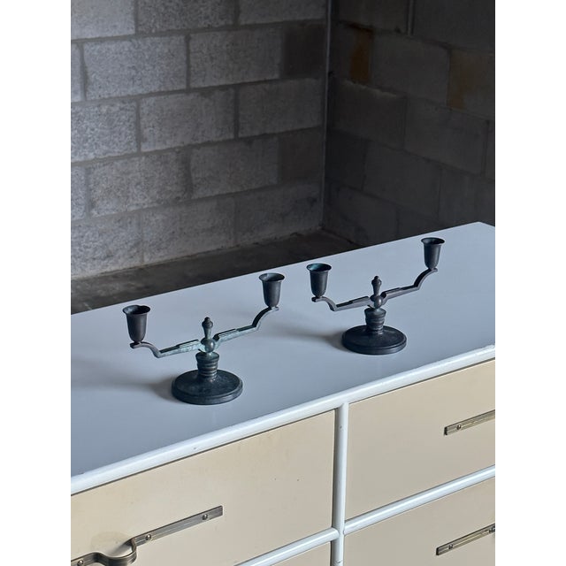 Gorgeous pair of patina bronze candelabras designed by Nils Johan, and marked on the underside "NJ" with "äkta brons...