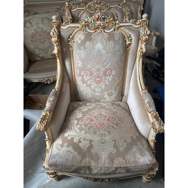 Truly a beauty! Sofa and matching armchairs. Needs a little love but worth the investment. Side and back material are a...