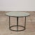 A side table in patinated bronze designed by Walter Lamb and produced by Brown Jordan. The round table is supported by...