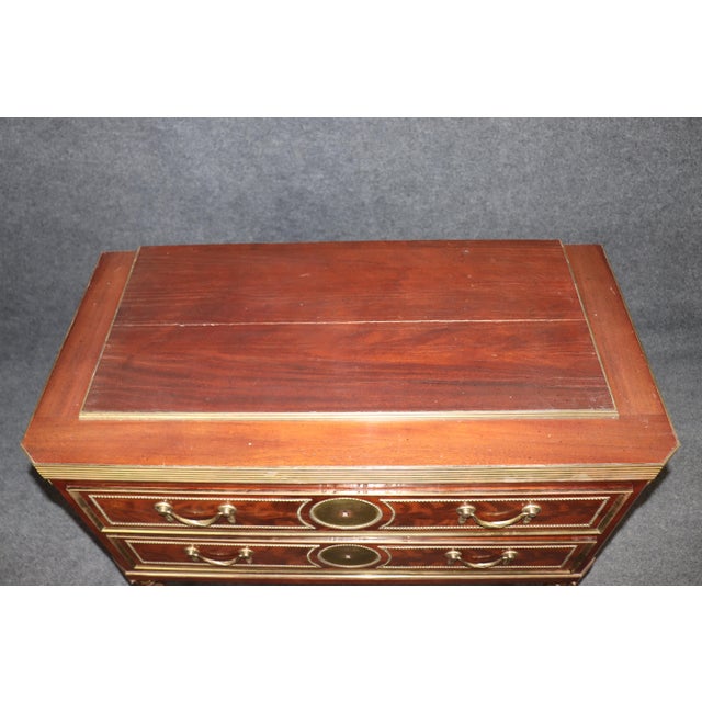 You can see it in the weight of them — in the way the lines stand firm and the bronze holds fast against the wood. This...