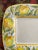 A large scale platter, measuring 15” x 15”, with a pierced foot for display on a wall. In bright pigments, hand painted...
