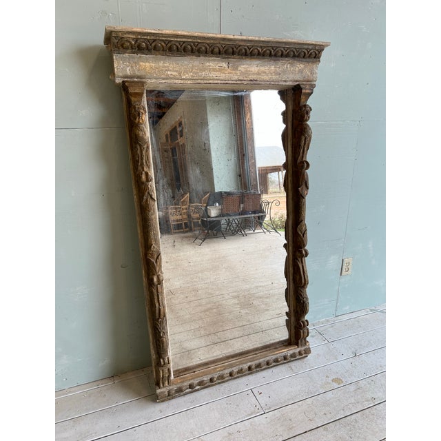 Beautiful 19th century carved Italian, pure mirror featuring carved faces and lovely patina. Perfect and entry or hallway,...