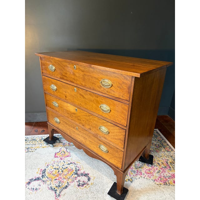 Offered for your consideration, A federal period Hepplewhite chest featuring four spacious drawers over a scalloped base...