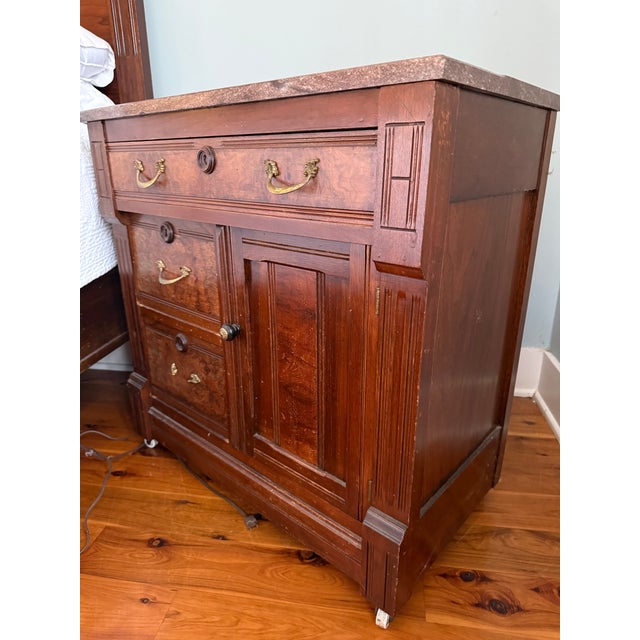 Victorian Nightstand. Part of a set (bed and dresser listed separately). Beautiful mahogany colored wood with a red/brown...