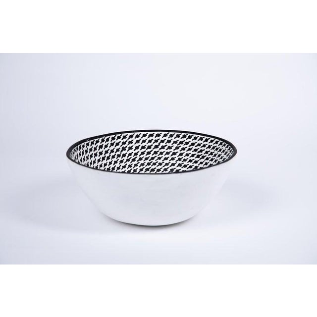 Mexican Mimbre white pottery bowl with traditional black cloud design on bowl interior. Painted black line rim all around...