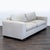 This Kreiss loveseat features a clean, modern design with wide arms and thick, plush cushions. The soft neutral fabric...