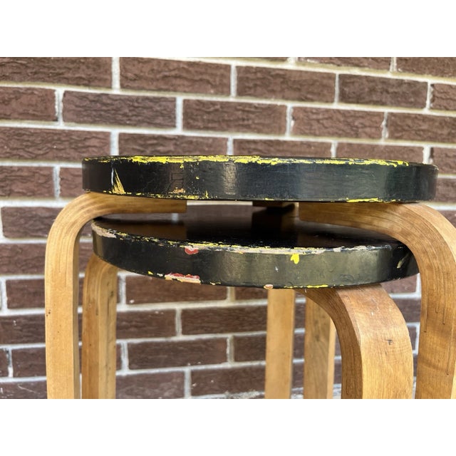 Fantastic pair of vintage Alvar Aalto model 60 stools. Unmarked. Lovely patina with a painted top and natural legs. Signs...