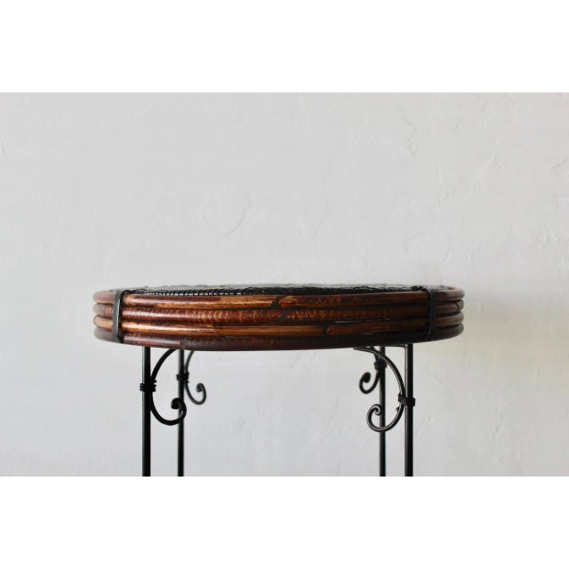 Wicker Bamboo Side Table. The top features a soft black woven wicker with the slim metal scroll base. The front is...