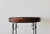 Wicker Bamboo Side Table. The top features a soft black woven wicker with the slim metal scroll base. The front is...
