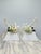 These are a stunning pair of vintage shell sculptures mounted on solid white marble pyramid bases, blending natural...