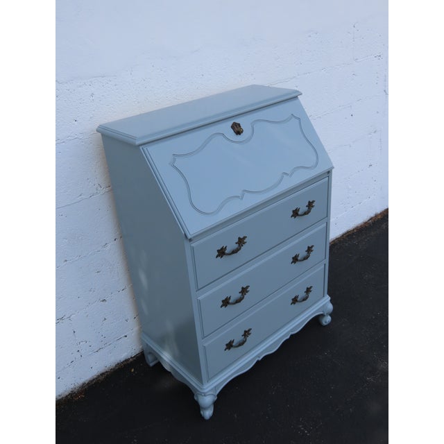 This Secretary Desk is made out of wood, solid wood, and metal. It was made by Jasper Cabinet and it is labeled. This...