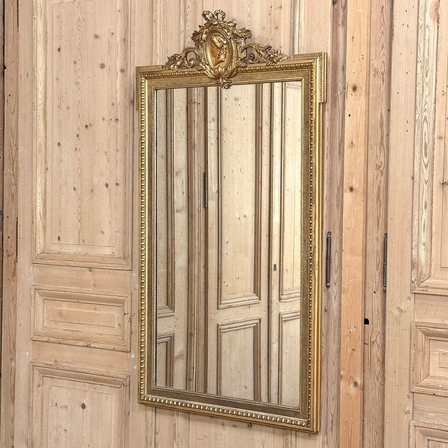 19th Century Dutch Gilded Mirror in the French Louis XVI Style was produced by G. Dorens & Co. in Amsterdam just before...