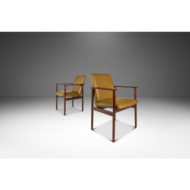 Introducing a rare, Dutch-made pair of armchairs produced by the lauded Amsterdam-based De Klerk & Sons firm. Built from a...