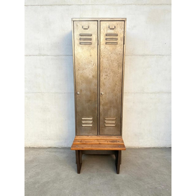 1970s East German steel factory lockers with stool. Lockable double doors with shelves & hangers inside. Wooden topped...