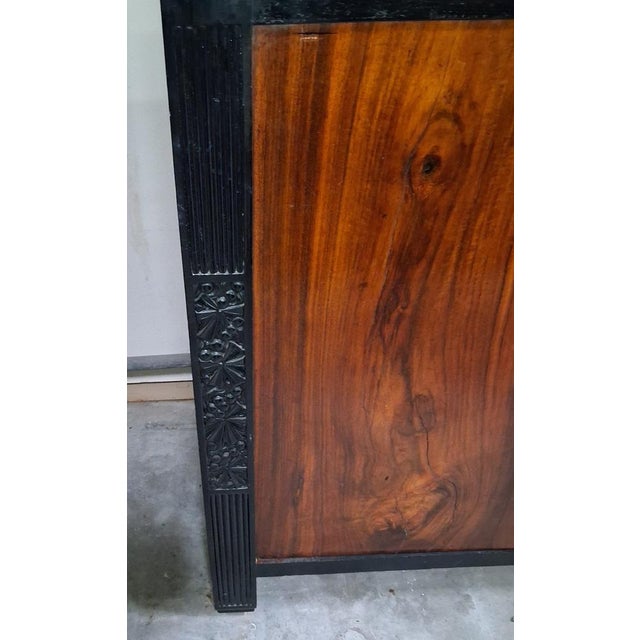 Art Deco-era display cabinet / sideboard in wood and blackened wood An elegant display piece from the Art Deco period,...