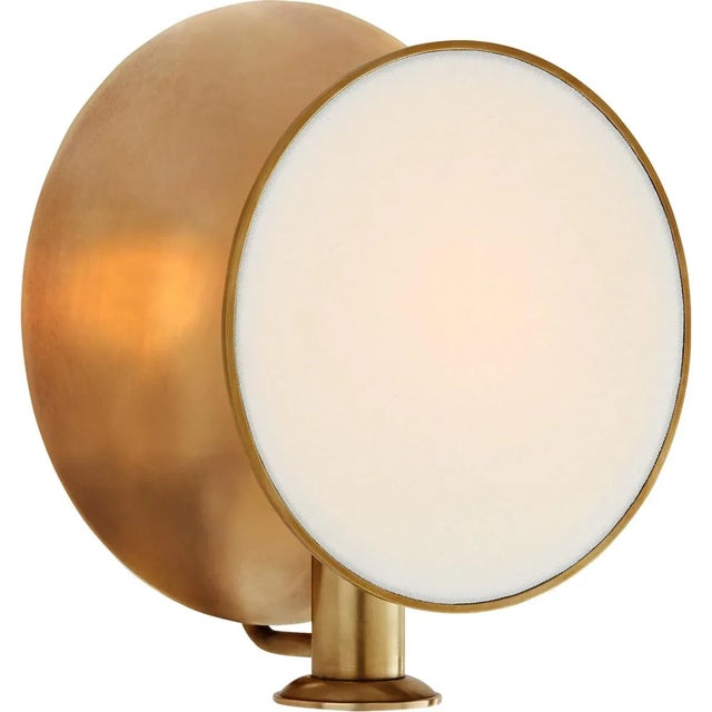 Osiris Single Reflector Sconce in Hand-Rubbed Antique Brass with Linen Diffuser Designer: Thomas O'Brien Height: 10.25"...