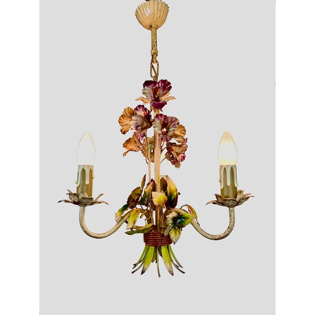 A charming French polychrome tôleware chandelier with three gracefully scrolling arms. Entirely crafted from hand-formed...