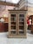 This antique solid oak display cabinet has been fully restored. It features two large, lockable glass doors that open to...