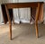 Mid century Danish modern-style drop leaf dining table by Garrison Furniture Company. The table features two retractable...